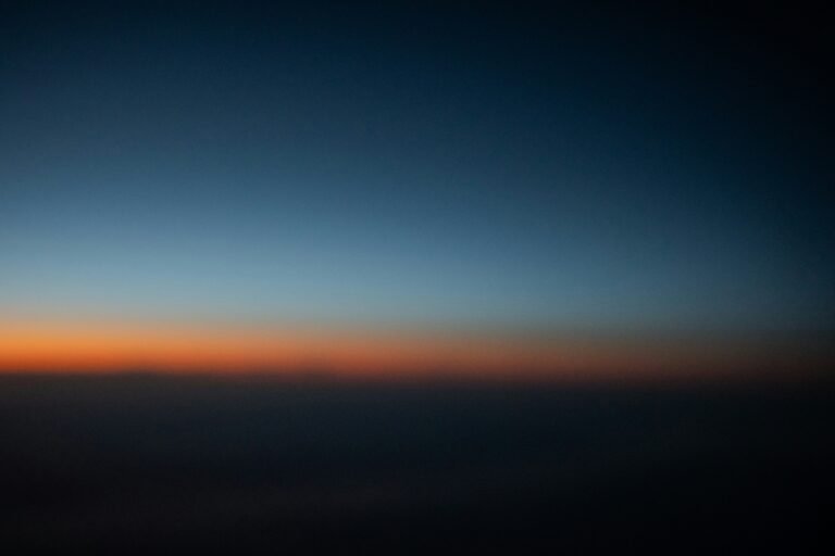 early morning dawn sky in soft indigo and gold
