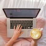 Freelancer working remotely with coffee and laptop